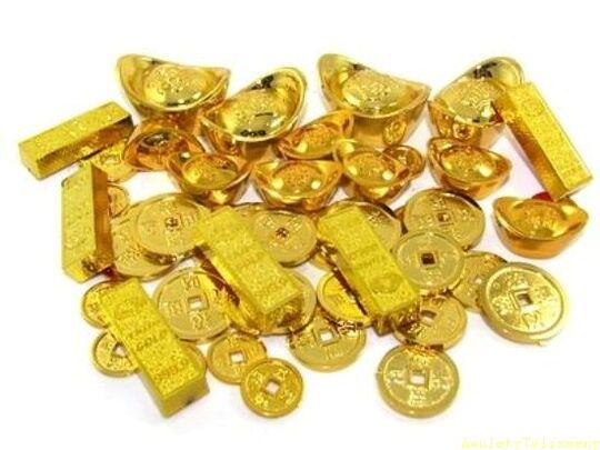 gold bars and coins as amulets of luck